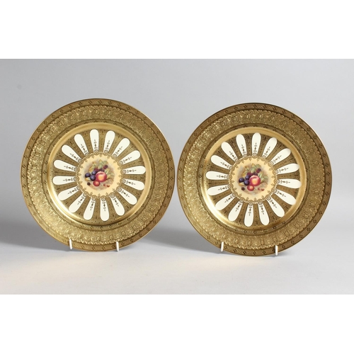 1201 - A GOOD PAIR OF AYNSLEY FRUIT PLATES with gold borders. 10ins diameter.