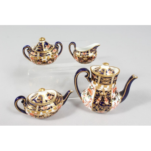 1207 - A MINIATURE CROWN DERBY PART SERVICE comprising teapot, coffee pot, sucrier and milk jug, teapot 3in... 