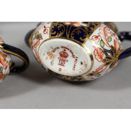 1207 - A MINIATURE CROWN DERBY PART SERVICE comprising teapot, coffee pot, sucrier and milk jug, teapot 3in... 