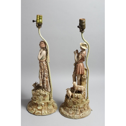 1214 - A PAIR OF ROYAL DUX PORCELAIN FIGURAL LAMP BASES one as a boy shepherd, the other a female with a go... 