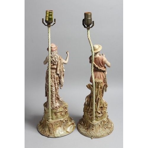 1214 - A PAIR OF ROYAL DUX PORCELAIN FIGURAL LAMP BASES one as a boy shepherd, the other a female with a go... 