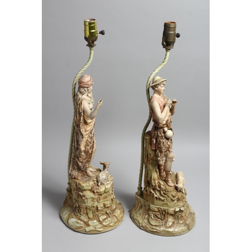 1214 - A PAIR OF ROYAL DUX PORCELAIN FIGURAL LAMP BASES one as a boy shepherd, the other a female with a go... 