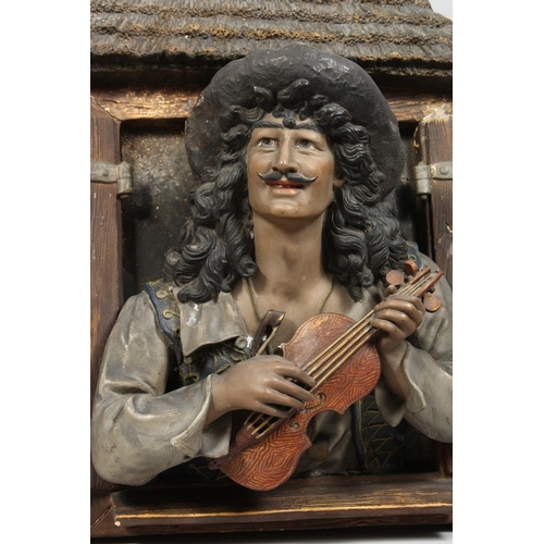 1216 - A LARGE PAIR OF CONTINENTAL POTTERY PLAQUES OF A MUSICIAN  AND A YOUNG LADY at an open window shutte... 