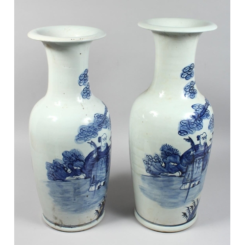 1234 - A LARGE NEAR PAIR OF CHINESE BLUE AND WHITE VASES painted with figures. 22ins & 23ins high.