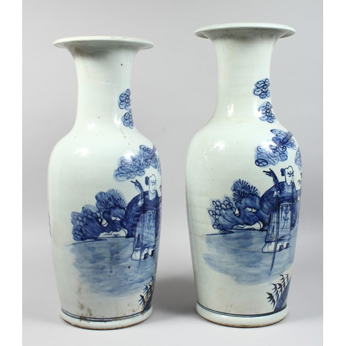 1234 - A LARGE NEAR PAIR OF CHINESE BLUE AND WHITE VASES painted with figures. 22ins & 23ins high.