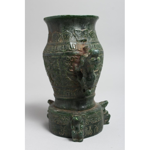 1240 - A CHINESE ARCHAIC STYLE JADEITE TWIN HANDLED VASE. 8ins high.