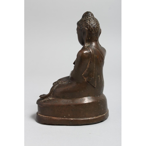 1242 - A CHINESE BRONZE SEATED BUDDHA. 6.5ins high.