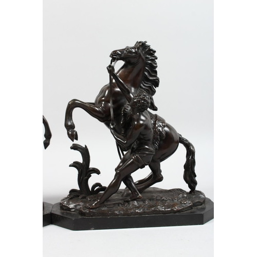 1251 - A SUPERB PAIR OF BRONZE HORSES AND ATTENDANTS on marble bases. 11ins high.