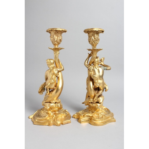 1272 - A PAIR OF GILT BRONZE CLASSICAL STYLE FIGURAL CANDLESTICKS. 11ins high.