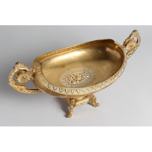 1275 - A DECORATIVE CLASSICAL STYLE GILT BRONZE TWIN HANDLED PEDESTAL OVAL SHAPE BOWL. 15.5ins high.