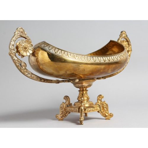 1275 - A DECORATIVE CLASSICAL STYLE GILT BRONZE TWIN HANDLED PEDESTAL OVAL SHAPE BOWL. 15.5ins high.