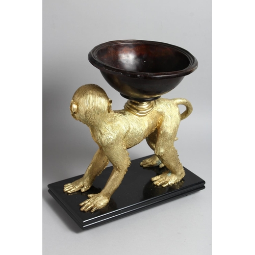 1276 - AN UNUSUAL  GILT BRONZE AND PATTINATED BRONZE CENTREPIECE modelled as a monkey on all fours, a bow o... 