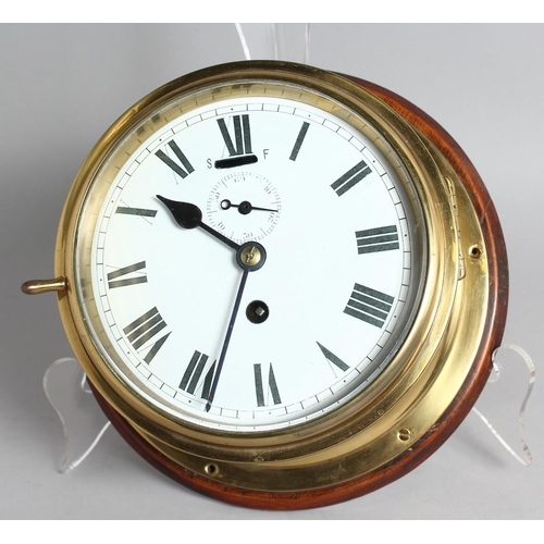 1285 - A BRASS CIRCULAR SHIP'S WALL CLOCK, 6ins dial, from the Troop Ship 