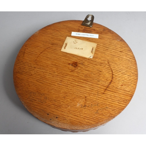 1288 - A GOOD OAK CASED CIRCULAR CLOCK with silvered dial, 7.5ins diameter, presented to Officers RAMC, Woo... 