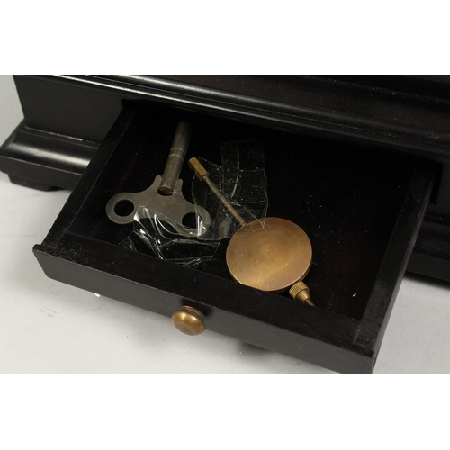 1290 - A MOONPHASE BRASS SKELETON CLOCK. 17ins in a glass case.