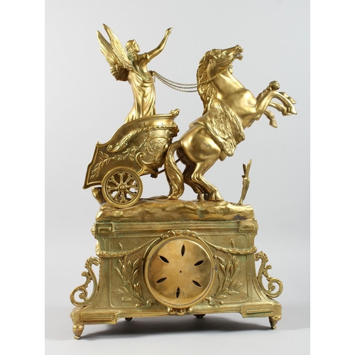 1296 - AN IMPRESSIVE VICTORIAN STYLE GILT BRONZE MANTLE CLOCK  the case surrounded with a horse and charrio... 