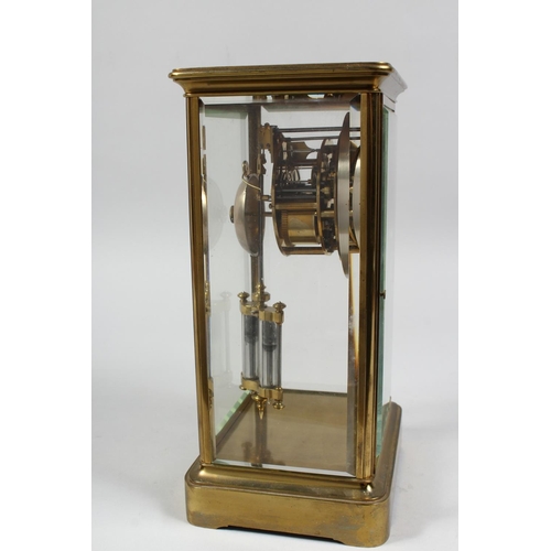 1299 - A BRASS FOUR GLASS MANTLE CLOCK with eight day movement striking on a bell, enamel dial with Roman n... 