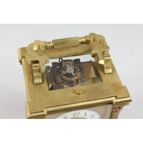 1301 - A GOOD GOLDSMITHS & SILVERSMITHS BRASS CARRIAGE CLOCK with repeat action and column supports. 6ins h... 