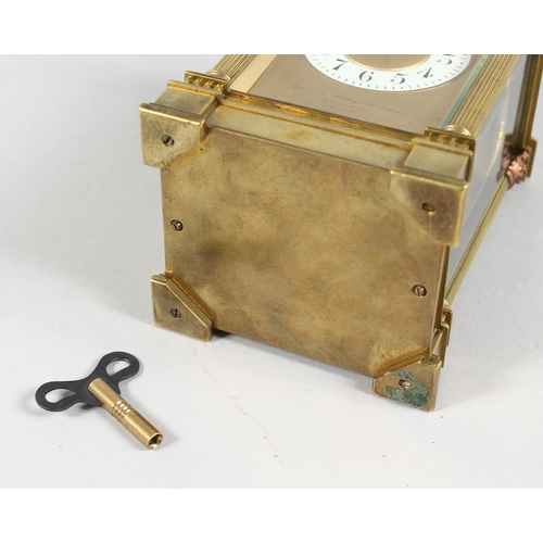 1301 - A GOOD GOLDSMITHS & SILVERSMITHS BRASS CARRIAGE CLOCK with repeat action and column supports. 6ins h... 