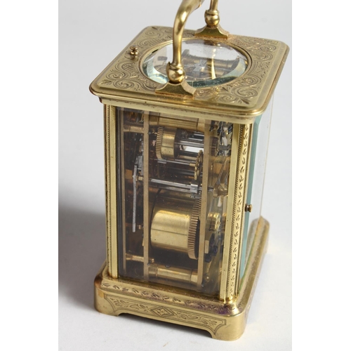 1310 - A GOOD FRENCH ENGRAVED BRASS CARRIAGE CLOCK with eight day movement, striking on a gong, enamel dial... 