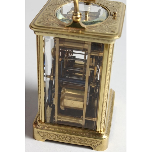 1310 - A GOOD FRENCH ENGRAVED BRASS CARRIAGE CLOCK with eight day movement, striking on a gong, enamel dial... 