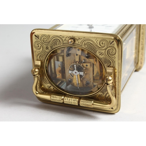 1310 - A GOOD FRENCH ENGRAVED BRASS CARRIAGE CLOCK with eight day movement, striking on a gong, enamel dial... 