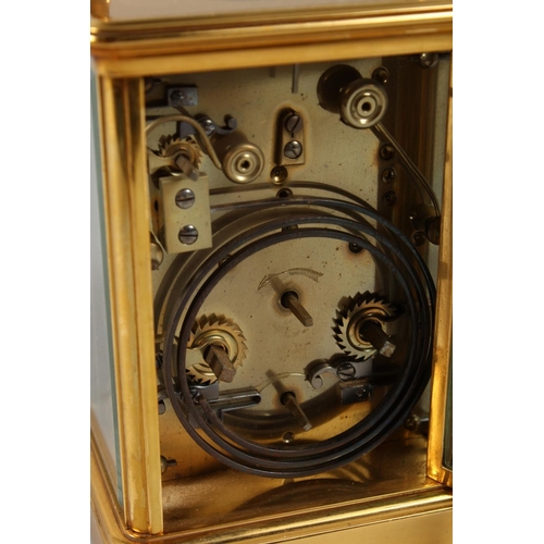 1311 - A FRENCH BRASS CARRIAGE CLOCK with eight day movement, striking on a gong enamel dial with subsidiar... 