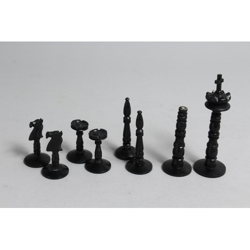 1326 - A CHESS SET in a wooden box, with black and white ivory chess pieces.