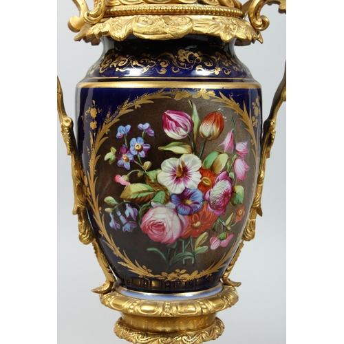 1335 - A PAIR OF PARIS PORCELAIN AND ORMOLU MOUNTED URN SHAPED TABLE LAMPS, painted with panels of flowers ... 