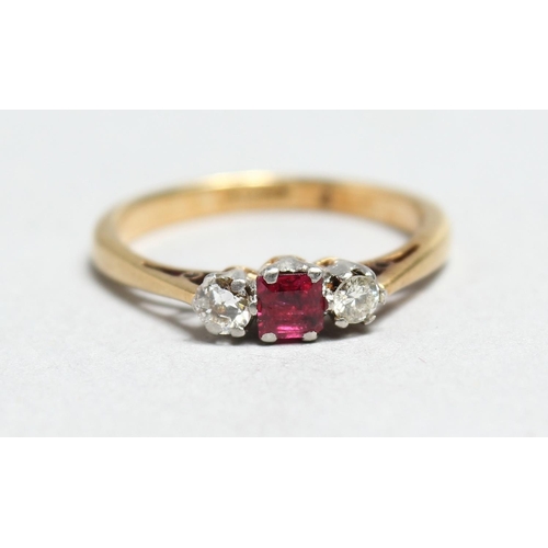 1696 - AN 18CT GOLD, RUBY AND DIAMOND THREE STONE RING.