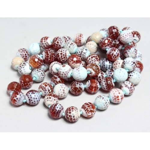 1698 - A LONG STRING OF FACET CUT AGATE BEADS, 44ins long.