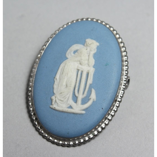 1700 - A SILVER MOUNTED WEDGWOOD  JASPERWARE BROOCH, 1.75ins high.