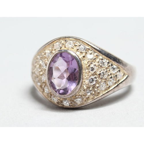 1703 - A SILVER AMETHYST AND CZ RING.