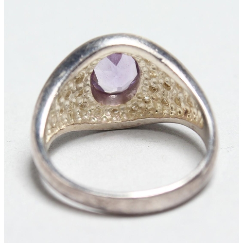 1703 - A SILVER AMETHYST AND CZ RING.