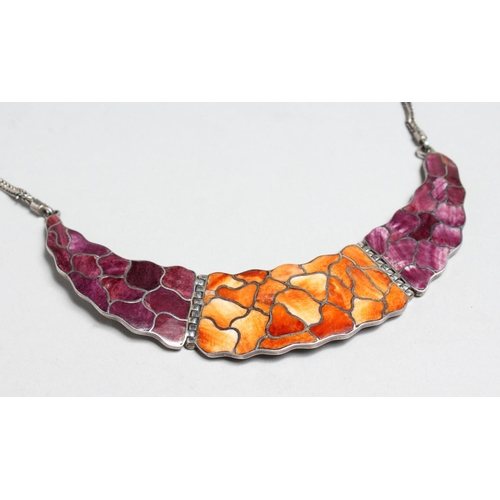 1706 - A SILVER CRESCENT SHAPE PENDANT AND CHAIN with orange and purple enamel decoration, 5ins wide.