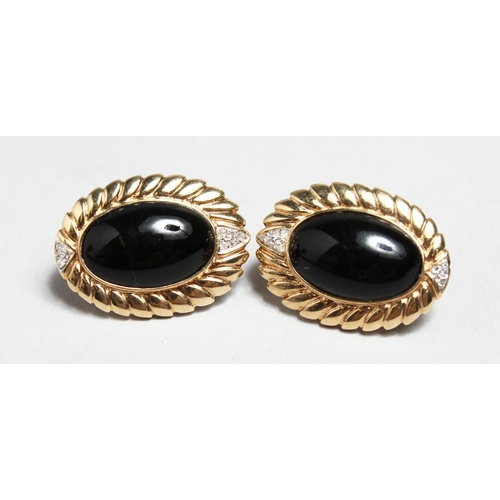 1711 - A PAIR OF OVAL 14CT GOLD, ONYX AND DIAMOND EARRINGS.