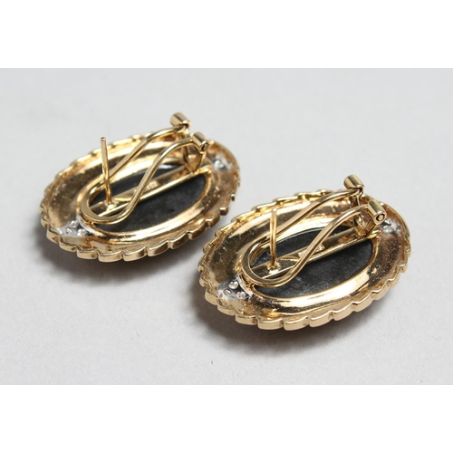 1711 - A PAIR OF OVAL 14CT GOLD, ONYX AND DIAMOND EARRINGS.