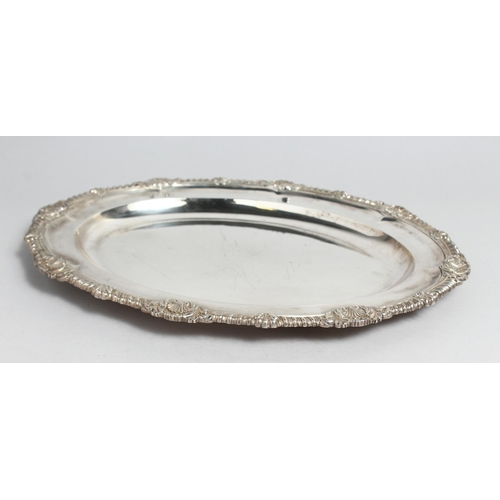 2045 - A GEORGE IV SILVER OVAL MEAT DISH with gadrooned and shell border, 17ins long. London 1823, maker R.... 