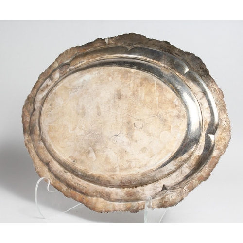 2045 - A GEORGE IV SILVER OVAL MEAT DISH with gadrooned and shell border, 17ins long. London 1823, maker R.... 