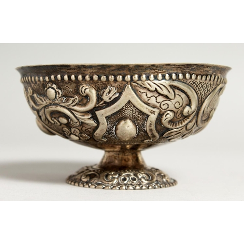 2046 - A CONTINENTAL SILVER EMBOSSED CIRCULAR PEDESTAL BOWL.