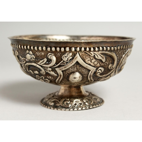 2046 - A CONTINENTAL SILVER EMBOSSED CIRCULAR PEDESTAL BOWL.