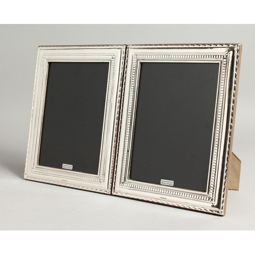 2048 - A LARGE PAIR OF SILVER PHOTOGRAPH FRAMES 22cm x 17cm.