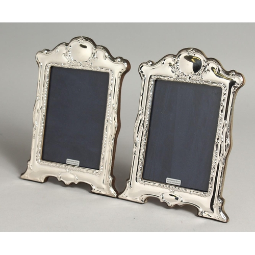 2050 - A LARGE PAIR OF SILVER PHOTOGRAPH FRAMES. 19cm x 14cm.