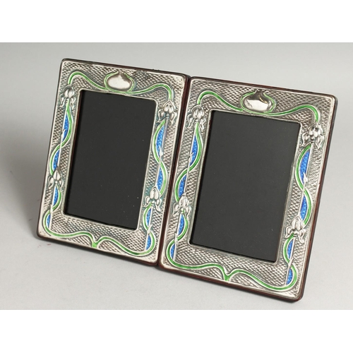 2052 - A PAIR OF SILVER AND BLUE ENAMEL PHOTOGRAPH FRAMES. 7.5ins x 5.5ins.