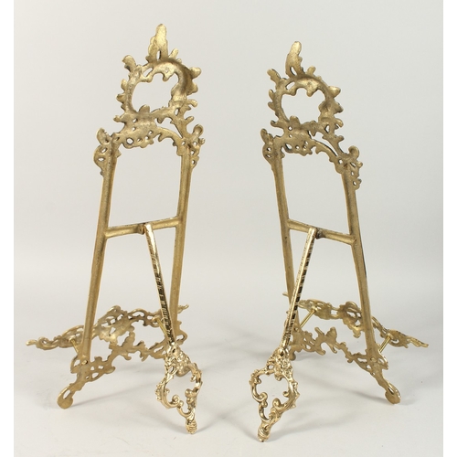 1343 - A PAIR OF BRASS PICTURE EASELS. 20ins high.