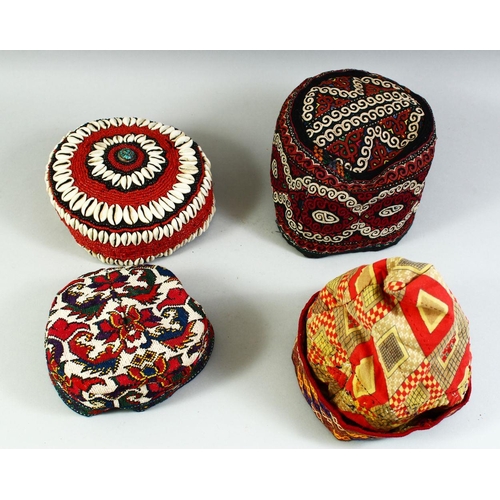 30 - FOUR VARIOUS UZBEK AND TURKAMAN EMBROIDERED HATS.