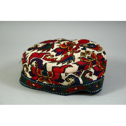 30 - FOUR VARIOUS UZBEK AND TURKAMAN EMBROIDERED HATS.