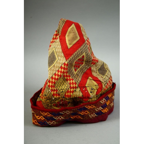 30 - FOUR VARIOUS UZBEK AND TURKAMAN EMBROIDERED HATS.