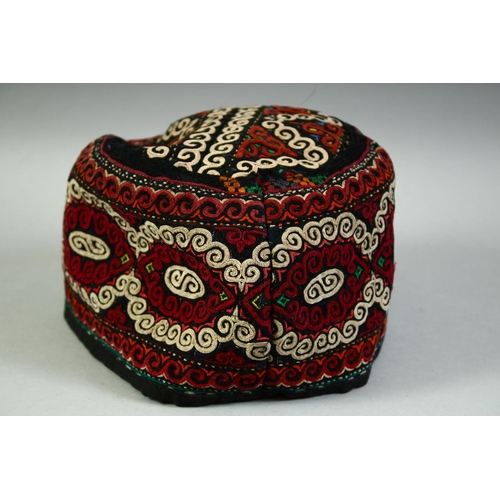 30 - FOUR VARIOUS UZBEK AND TURKAMAN EMBROIDERED HATS.