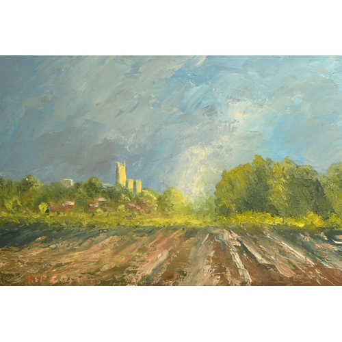 2572 - Kip Combes (20th Century), a view of a church tower over ploughed fields, oil on board, signed, 7